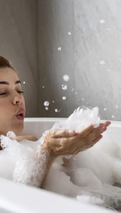 Woman Enjoying Relaxing Bubble Bath